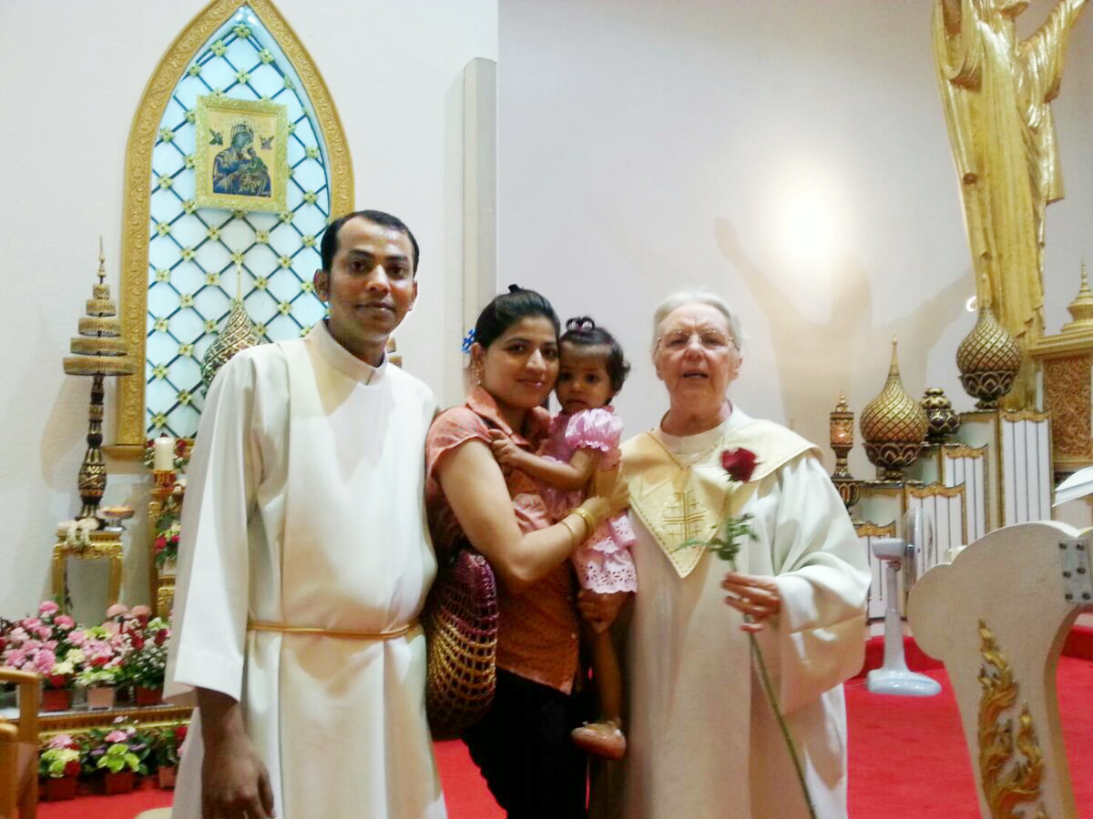 a refugee family stands in a church